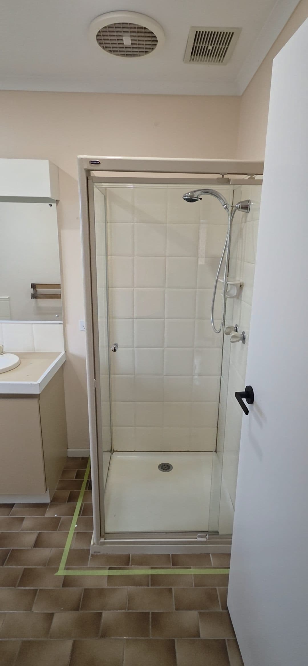 Old shower area before full bathroom renovation