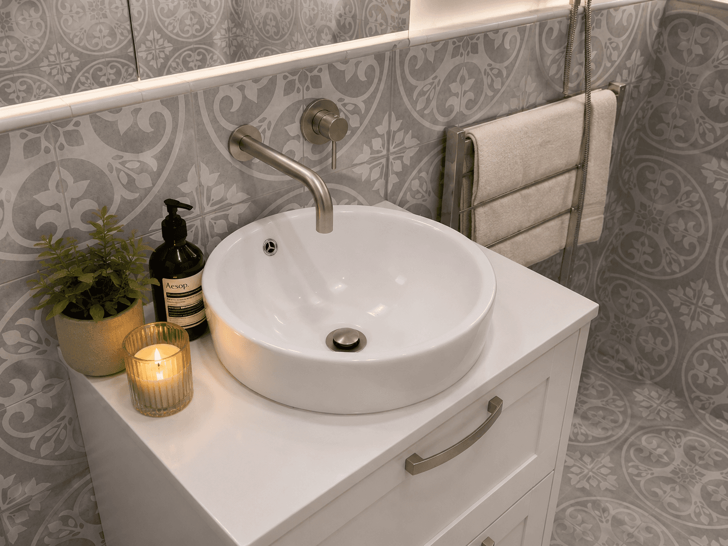 Malvern East vanity detail with round basin, brushed tapware and patterned tile